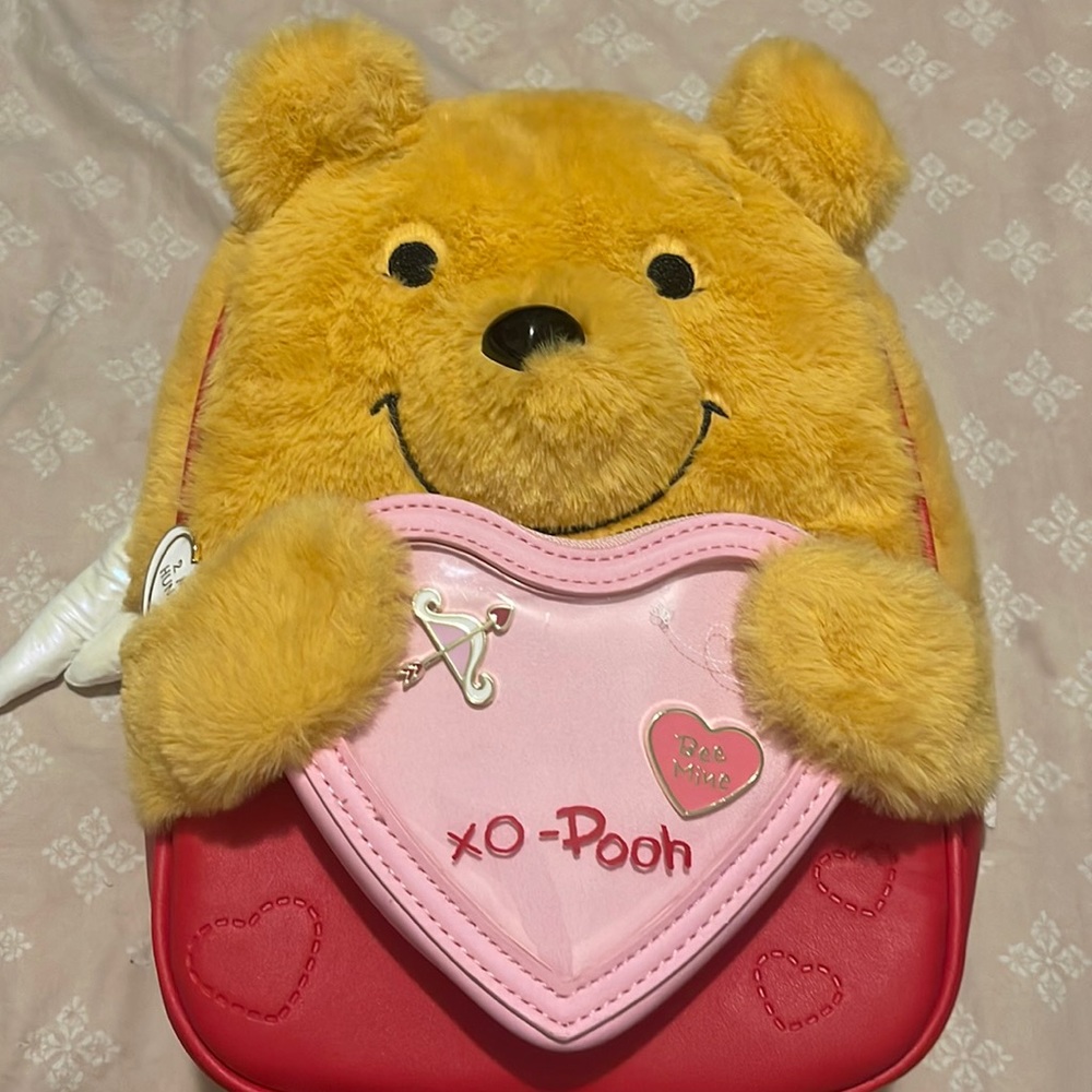 Disney’s Her Universe Winnie The Pooh Heart Pin Collection Mini Backpack.